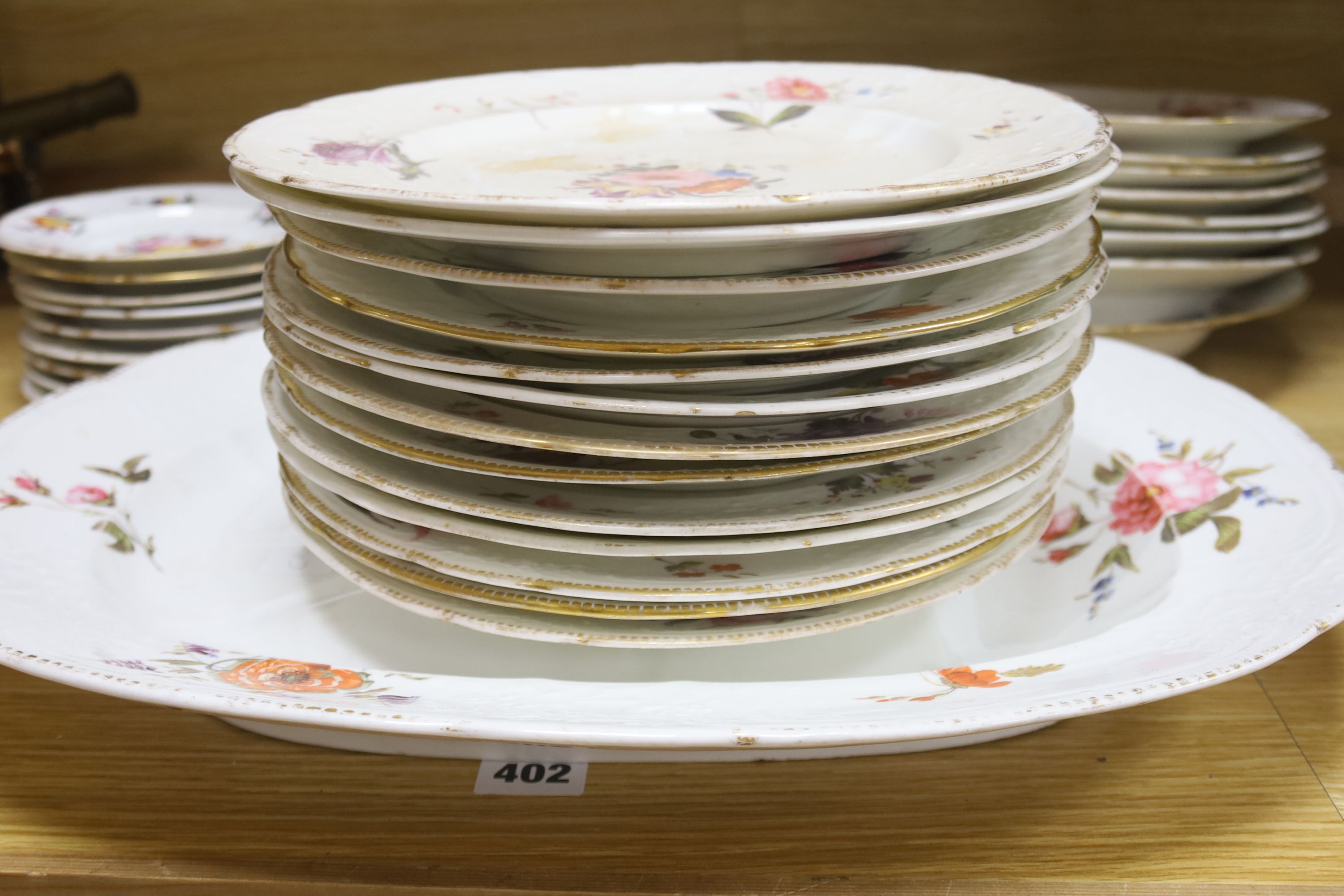 An English porcelain part dinner service, c.1825-30, and other similar plates